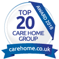 Circular badge displaying Top 20 Care Home Group Award 2018 with a blue ribbon at the bottom showing carehome.co.uk, highlighting exemplary service in respite care.