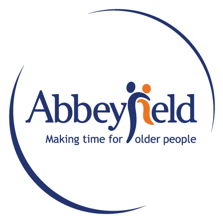 Logo of Abbeyfield, a residential care home, featuring two stylised human figures and the tagline Making time for older people.